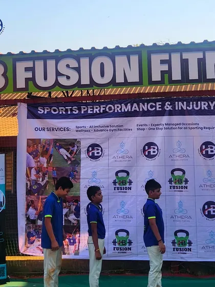Students stand in front of the banner for our Sports Performance & Injury Prevention Camp. These specialized camps are a key part of our commitment to holistic athlete development.