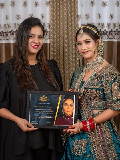 Me with one of my students and her final portfolio look. She mastered this intricate North Indian bridal style during her diploma course.