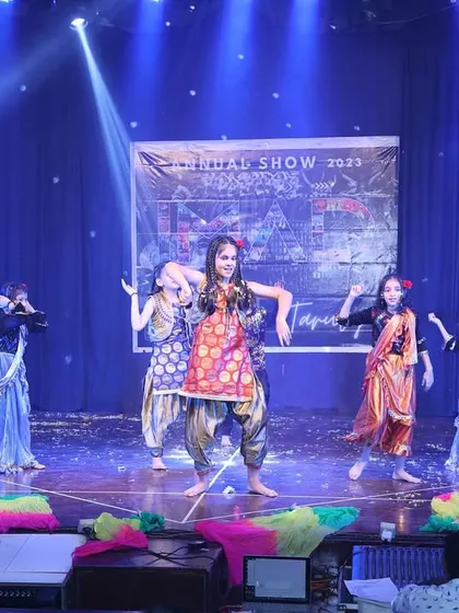 A fusion performance blending different styles and colorful costumes, celebrating the joy of dance.