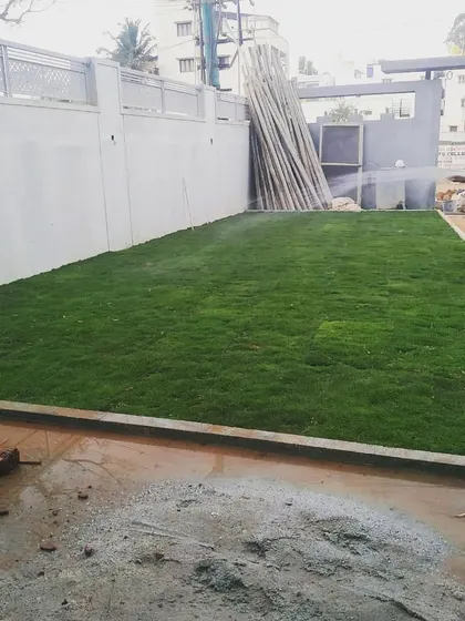 Another shot of the watering process, a critical step in our lawn installation service to ensure a healthy, green result.