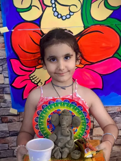 This little one is all smiles with her handmade Ganesha. Our clay workshops are designed to be fun and accessible for kids of all ages, helping them develop fine motor skills while celebrating our culture.