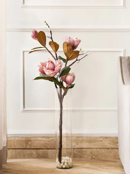 The artificial magnolia stem is also available in a lovely soft pink. This delicate color adds a gentle touch of romance and springtime to your home decor.