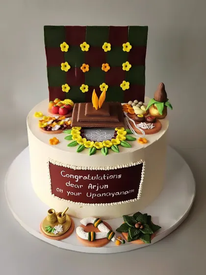 Another view of Arjun's Upanayana cake. I was thrilled to take on this challenge and bring the client's vision for this custom-themed chocolate truffle cake to life.