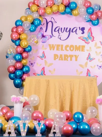 A charming 'Baby Shark' themed birthday party, featuring a vibrant underwater backdrop, character cutouts of the shark family, and blue and yellow balloons, perfect for a fun-filled celebration.