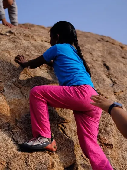 A helping hand for a young, first-time climber. Our outreach sessions are about providing opportunity, encouragement, and a fun introduction to the sport.