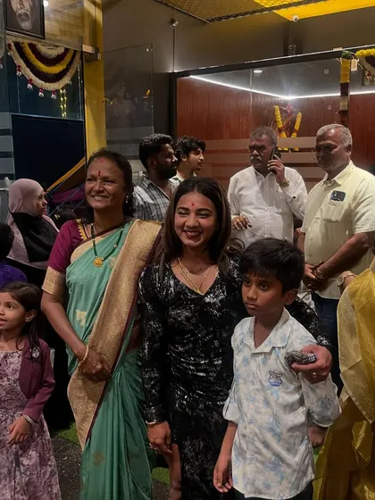 Posing for photos with family and fans at the event. These moments are what make the journey worthwhile.