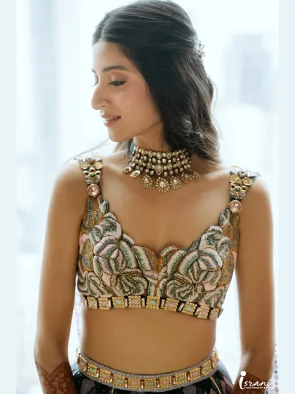 A close-up of the Sangeet makeup. I created a soft, winged liner and a natural lip to balance the intricate details of her blouse.