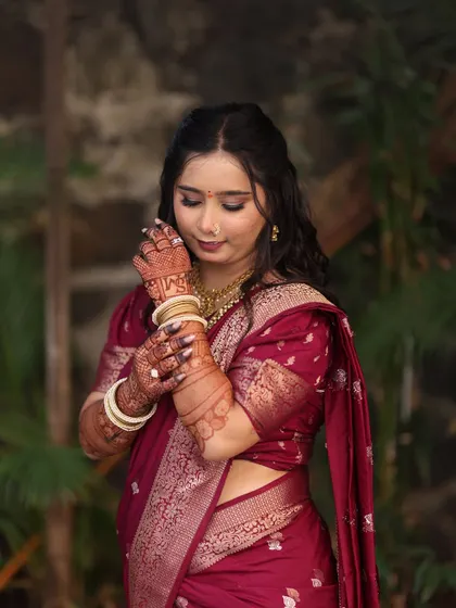 A shy glance from the bride-to-be. The soft, romantic makeup style enhances her natural beauty and captures the emotion of the moment.