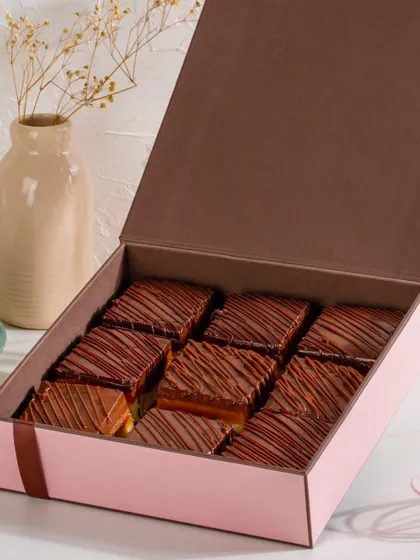 A gift box filled with our irresistible Millionaire Shortbread. The rich chocolate, melt-in-your-mouth caramel, and crunchy shortbread make this one of our most popular gifting items.