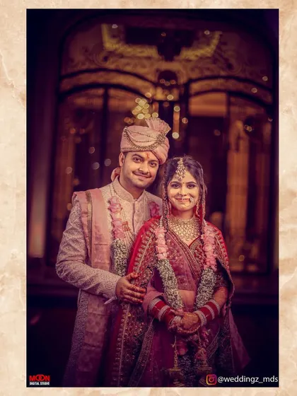 A beautifully lit, classic portrait of the bride and groom in their wedding attire.