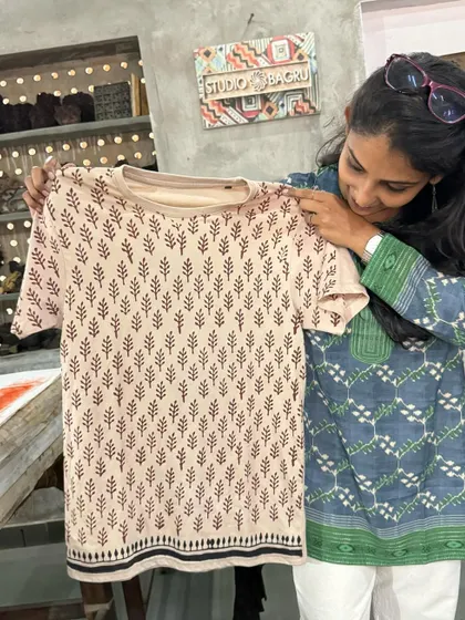 A final look at my finished tee. The pattern is simple yet elegant, and the natural dyes give it a soft, earthy feel.