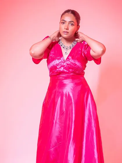 The rich taffeta silk of this pink gown gives it a beautiful sheen and structure.