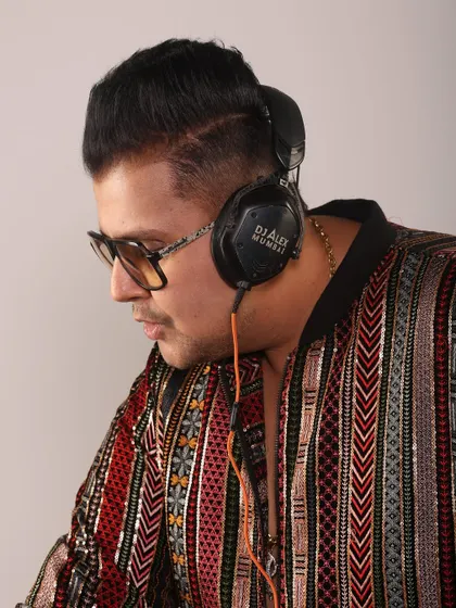 A close-up profile shot from a photoshoot. The focus is on the music, the headphones, and the intensity I bring to my craft.