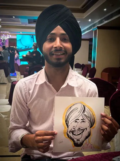 A young guest with his caricature, a great way to entertain people of all ages.
