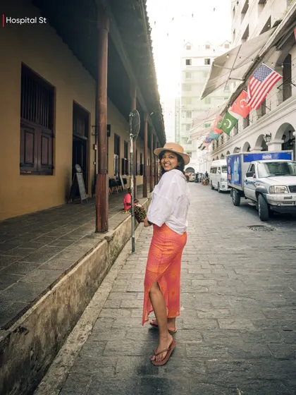 A photo of me exploring the charming, cobblestoned Hospital Street in Colombo, a beautifully restored area with colonial-era architecture.
