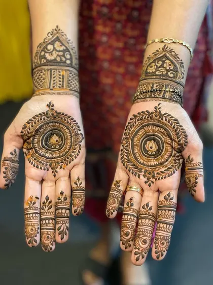 A beautiful mandala design with a lotus in the center. The patterns are clean and symmetrical, perfect for any festive occasion.