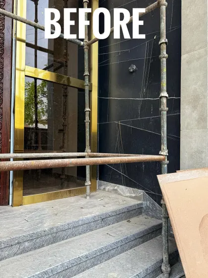 The "Before" shot of the entrance, with scaffolding and construction materials. It's hard to believe it's the same space!