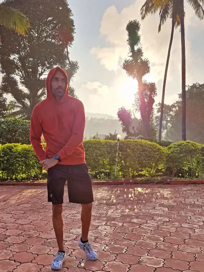 Keeping my luck safely, also known as hard work. Enjoying the cool Coorg weather in a sweatshirt after a good session.
