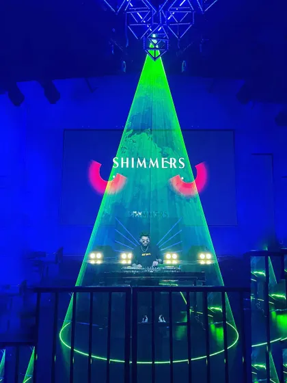 My view from the stage, framed by a laser cage and my custom 'Shimmers' Halloween visuals. The production is a huge part of the experience.