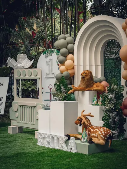 A different perspective of the safari birthday theme, showing how the layered backdrops and props create depth and a sense of being in a real jungle.