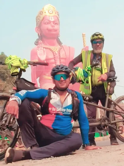 Posing with a Hanuman statue for blessings during the long and arduous 600km journey.