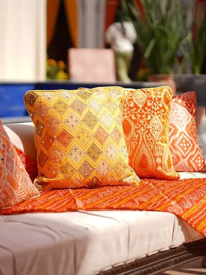 Comfort with a touch of tradition. The lounge seating was adorned with colorful cushions featuring mirror work and 'bandhani' print throws, tying the entire look together.
