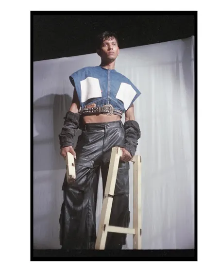 A powerful stance captured on 35mm film, with the model in a deconstructed denim and leather outfit. The film's grain adds a gritty texture that complements the edgy styling.