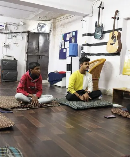 A group of students in our Hobby Hub vocal class, listening to their instructor. This image shows the diverse age range of students who join our after-school programs.