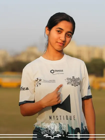 A simple point to the crest says it all. This player's pride in her team is evident.