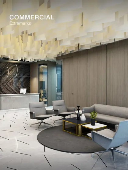The commercial interior for Extramarks features a refined reception and waiting area. We used a combination of marble-patterned flooring, wood-panelled walls, and a suspended ceiling feature to create a professional and welcoming first impression.