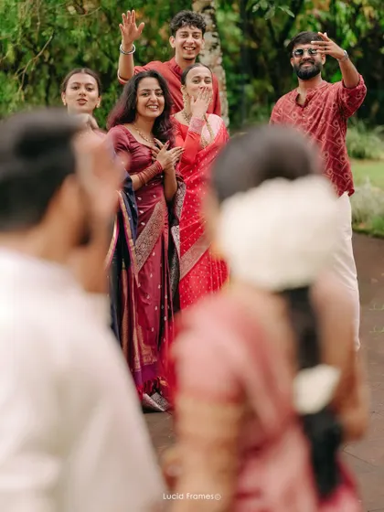 A shot from the couple's perspective, looking at their happy and welcoming friends.