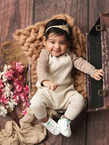 This little traveler is ready for an adventure! A sitter session is a great time to use fun props like this vintage suitcase.