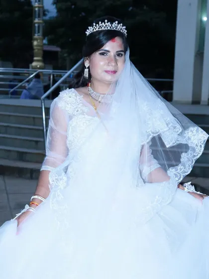 A portrait of a Christian bride in her white wedding gown, complete with a veil and tiara.