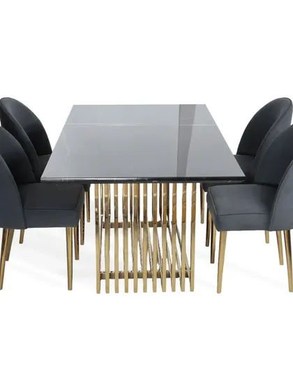 A complete 6-seater dining set designed for modern interiors. The table has a grey marble-finish top and a cage-like PVD gold base, paired with curved dining chairs upholstered in a sophisticated grey suede fabric.