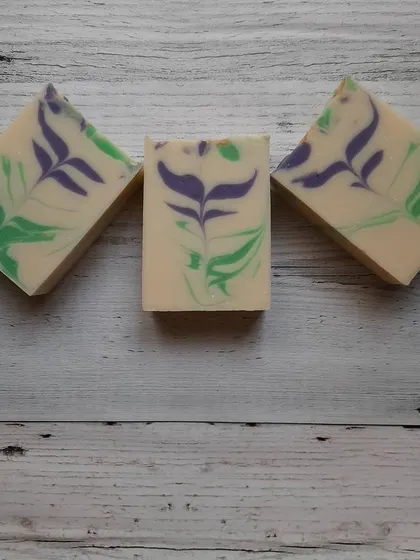 A trio of my Blooming Lavender soaps, showcasing the beautiful purple and green patterns. These bars are made with skin-loving oils and butters for a creamy, nourishing lather.
