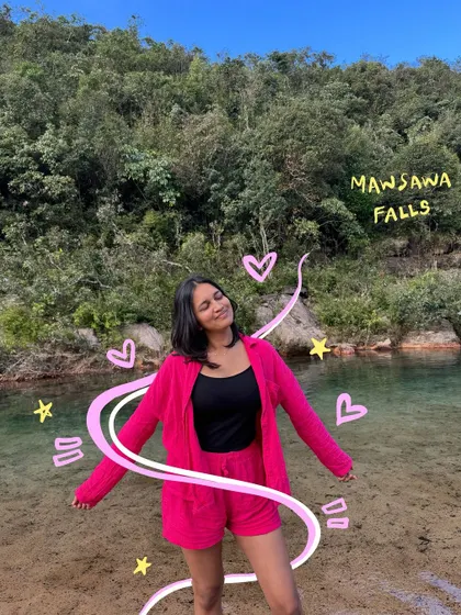 Enjoying the clear water at Mawsawa Falls. The pink doodles and stars add a magical touch to this serene moment.