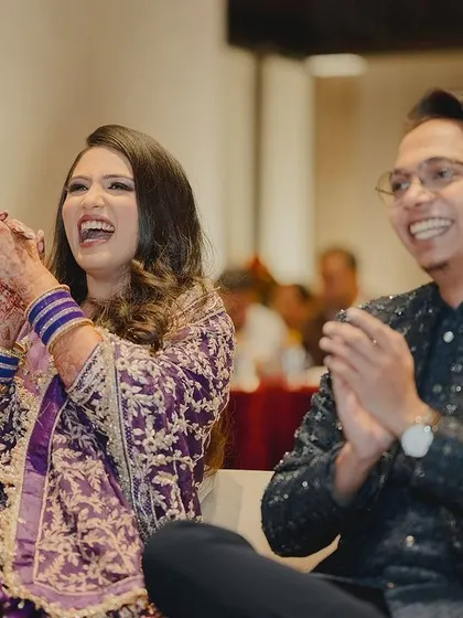 The best view in the house. Capturing the bride and groom's genuine laughter and joy as they watch their loved ones perform is a key part of my role.