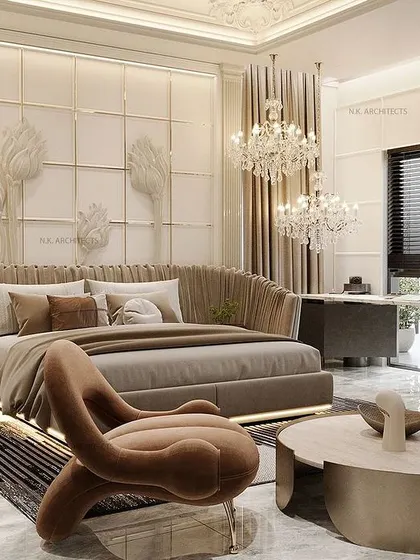 In the lap of luxury, this bedroom exudes grandeur and tranquility. The design features a unique curved bed, sculptural chairs, and beautiful 3D wall art, creating a symphony of comfort and style that embodies timeless elegance.