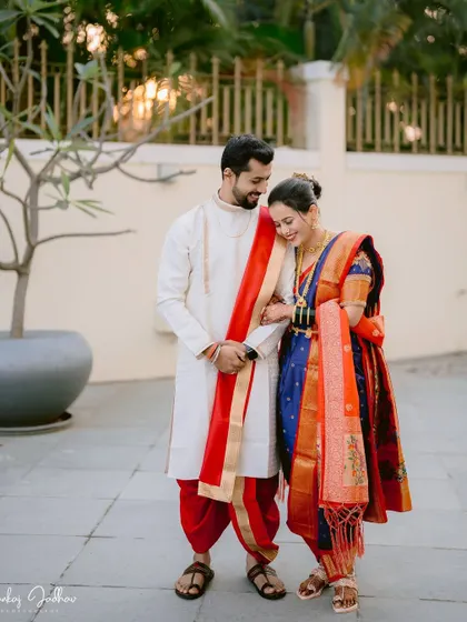 A candid and sweet moment between the couple, sharing a quiet laugh.
