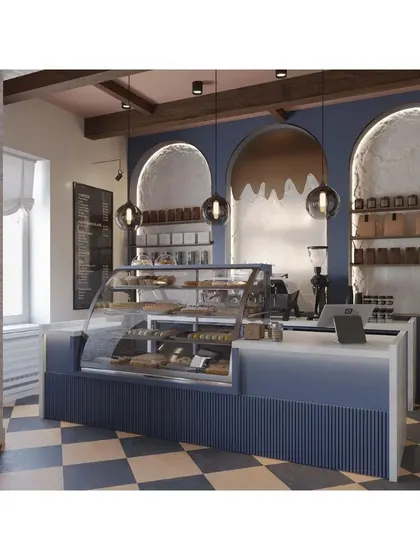 The service counter features a navy blue fluted base and a clean white top, set against arched niches. The design is both stylish and practical for a busy cafe environment.
