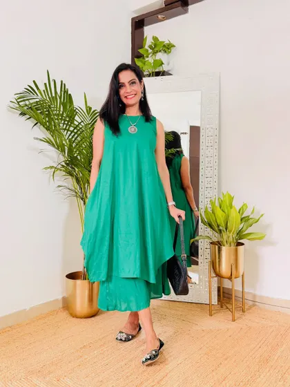 An interesting asymmetrical green co-ord set. This is a modern and edgy design for someone who likes to experiment with their style.