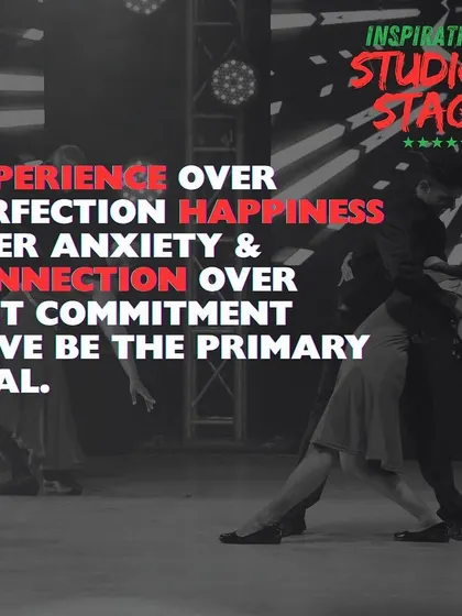 Our goal is experience over perfection and connection over commitment. This image of a partner dance on stage captures the emotion and artistry we strive for.