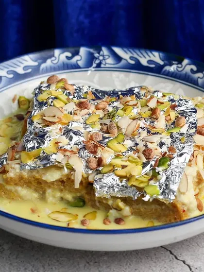 The classic Iftaar dessert, Shahi Tukda, garnished with nuts and edible silver leaf.