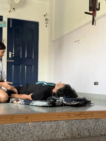 A bodywork session with my aunt. It's a joy to share this healing practice with family, helping them release tension and find relaxation before their travels.