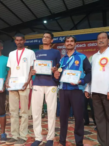 On the podium after winning first prize at the Mysore Dasara Yogasana Competition in 2024. This is a prestigious state level event that attracts serious competitors.