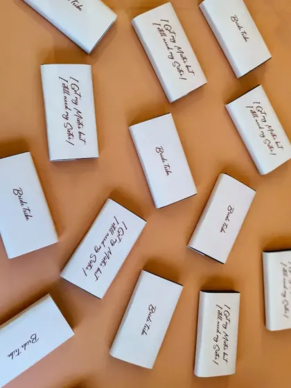 Even the smallest details matter. These custom chocolate bars were included in the bridesmaid hampers, with sweet messages like "I Got My Mister but I still need my Sister!"