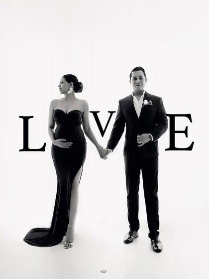 A creative shot that spells out the love. This is a fun way to add a personal touch to your maternity couple's photoshoot.