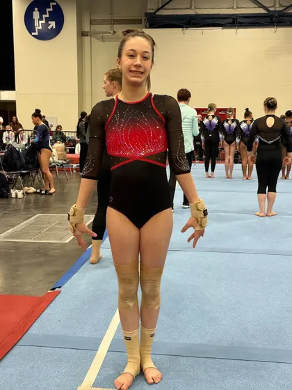 An Optional Team gymnast on the floor, ready to compete at The Biles Invitational.