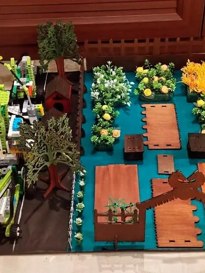 A garden automation project built with LEGOs by our 'Tech Titans' team. It includes a robotic arm and demonstrates how technology can be used in agriculture and horticulture.
