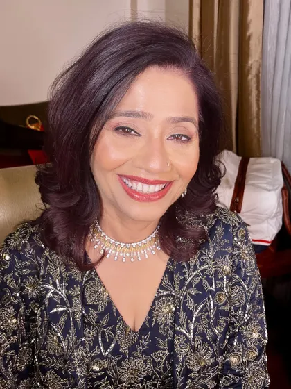 A beautiful, warm smile from the mother of the groom.